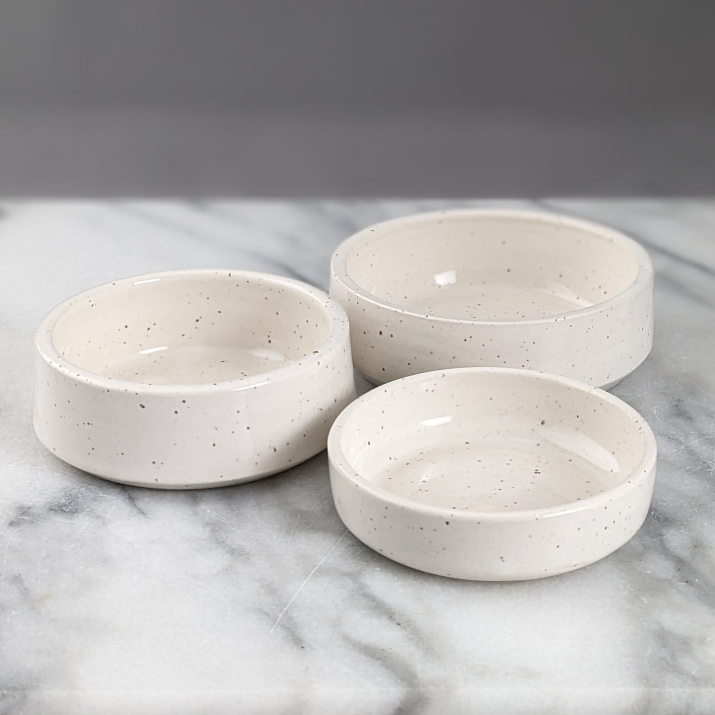 Set of Three White Speckled Dishes
